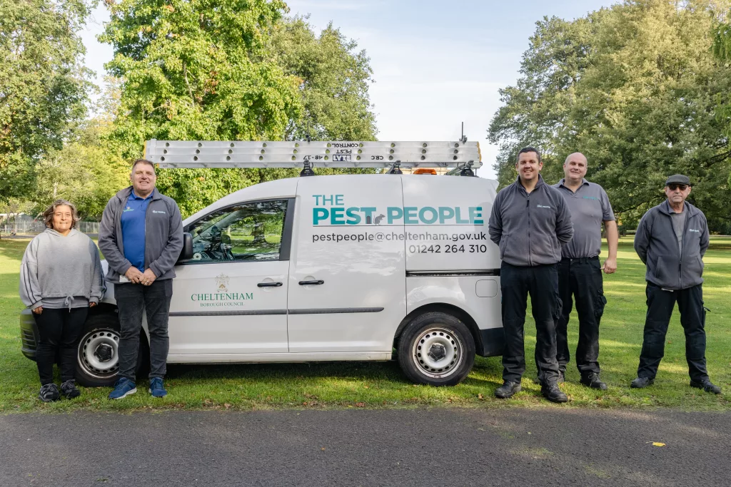 Our pest control team standing by one of our vans in Pittville Park